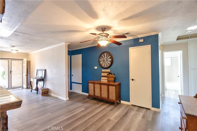 25602 Malaga Rd, Menifee, CA 92585 - living room featuring wood finished floors, ceiling fan, baseboards, and crown molding