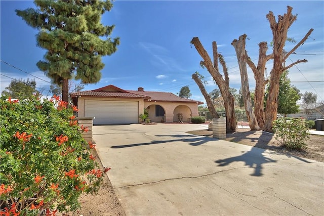 25602 Malaga Rd, Menifee, CA 92585 - view of front of home with stucco siding, an attached garage, concrete driveway, and a tiled roof
