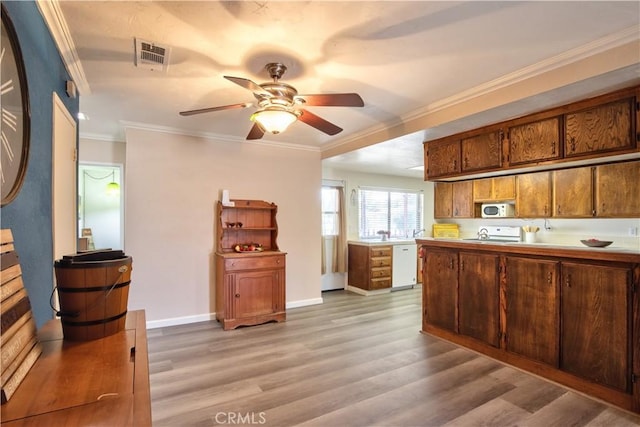 25602 Malaga Rd, Menifee, CA 92585 - kitchen with white appliances, light wood finished floors, ceiling fan, light countertops, and brown cabinets
