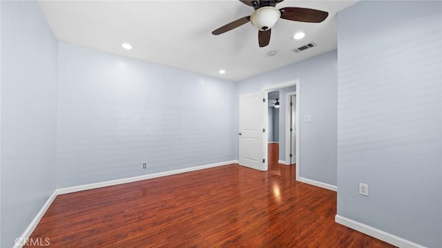 spare room featuring baseboards, visible vents, wood finished floors, and recessed lighting