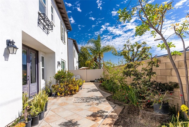 view of patio / terrace with french doors and a fenced backyard