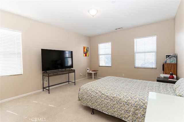 bedroom featuring carpet, visible vents, and baseboards