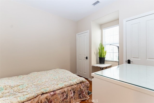 bedroom with visible vents