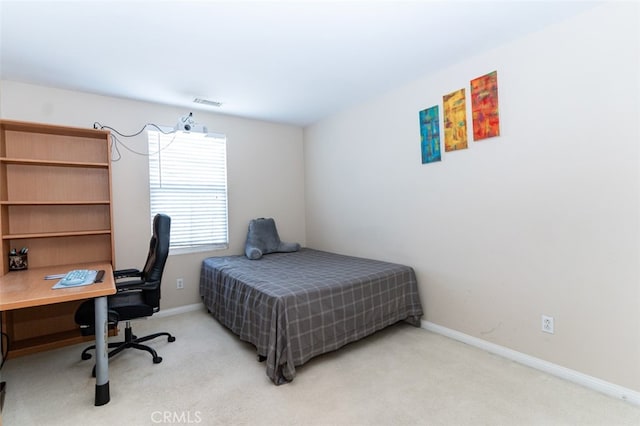 carpeted bedroom with visible vents and baseboards