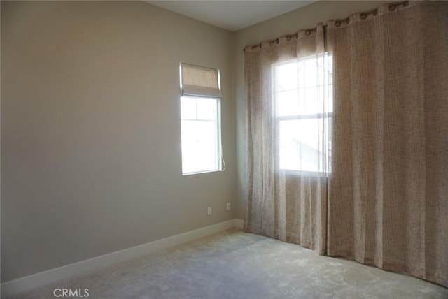 spare room featuring baseboards