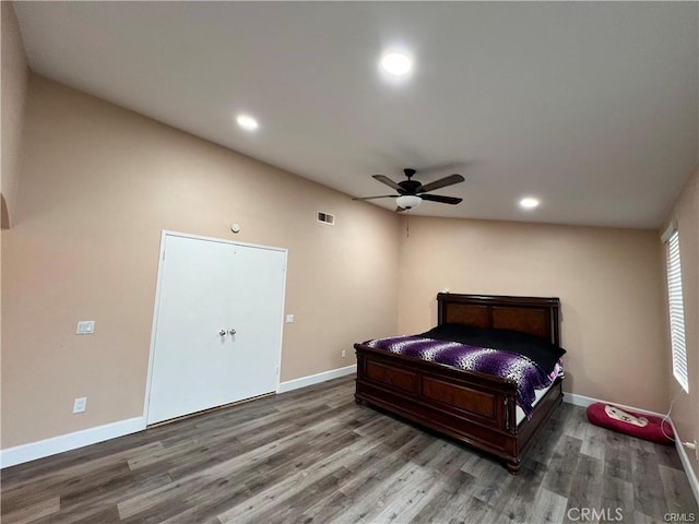 bedroom with recessed lighting, visible vents, baseboards, and wood finished floors