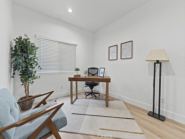 home office with light wood-style floors, recessed lighting, and baseboards