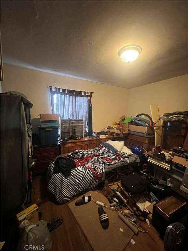 bedroom with wood finished floors