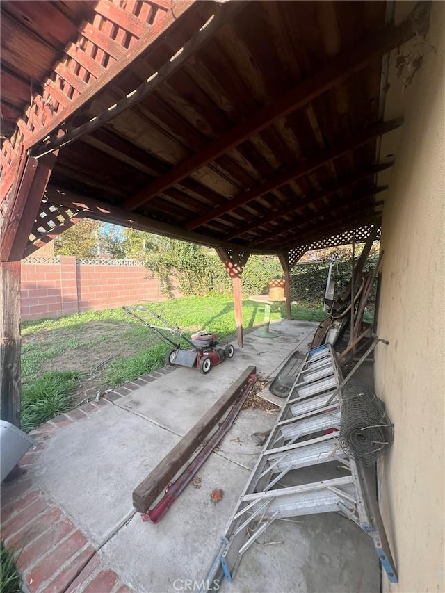 view of patio / terrace featuring fence