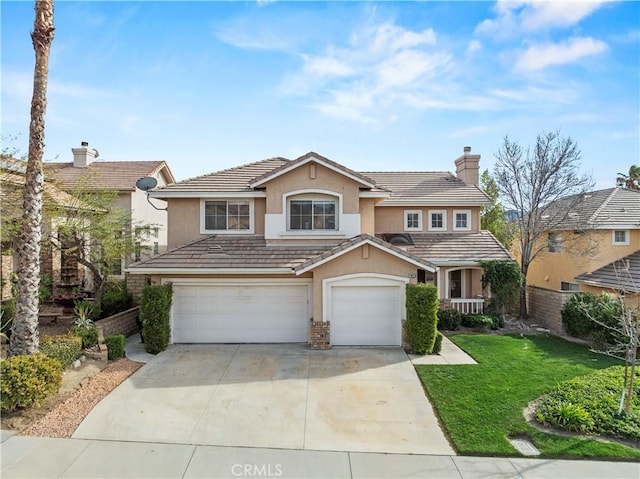 traditional-style home featuring a tiled roof, a front yard, an attached garage, and stucco siding