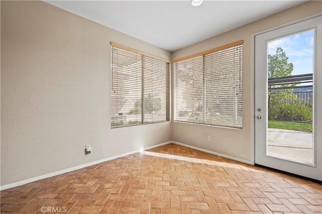 14218 Yellowstone Ln, Canyon Country, CA 91387 - spare room with brick patterned floors and baseboards