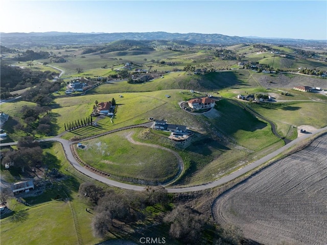 drone / aerial view with a mountain view and a rural view