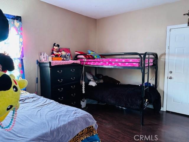 bedroom featuring wood finished floors