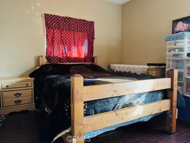 bedroom featuring wood finished floors