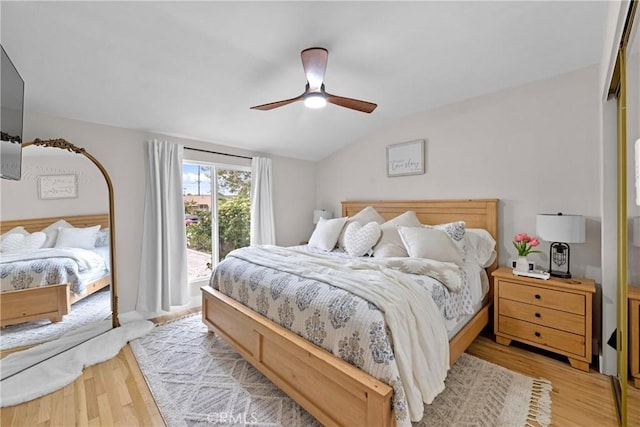 bedroom with light wood-style floors, ceiling fan, access to exterior, and lofted ceiling