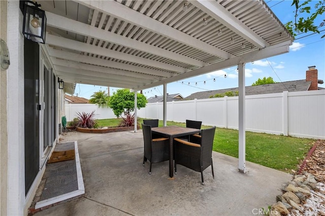 view of patio featuring a fenced backyard and outdoor dining area