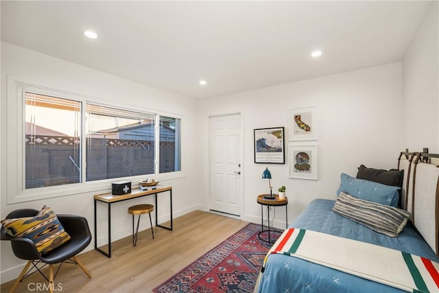 bedroom featuring recessed lighting, light wood-type flooring, and baseboards