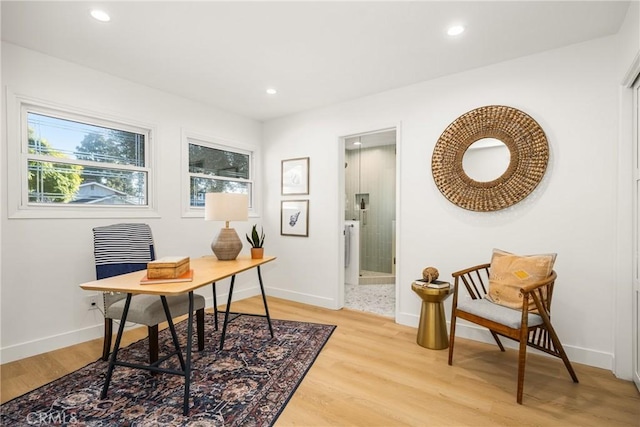 home office with recessed lighting, light wood-style flooring, and baseboards