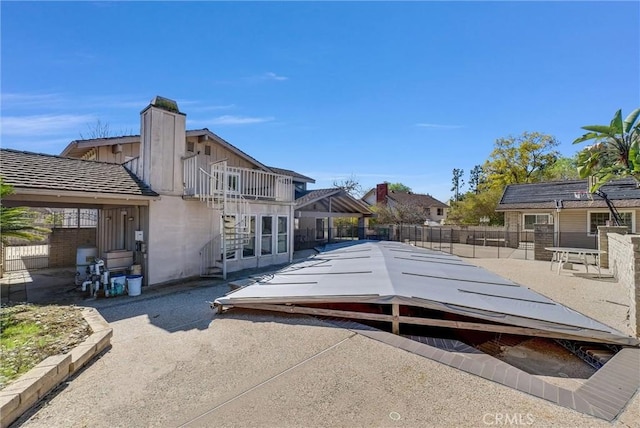 22517 Lazy Meadow Dr, Diamond Bar, CA 91765 - view of side of property featuring fence, a patio, a chimney, and french doors