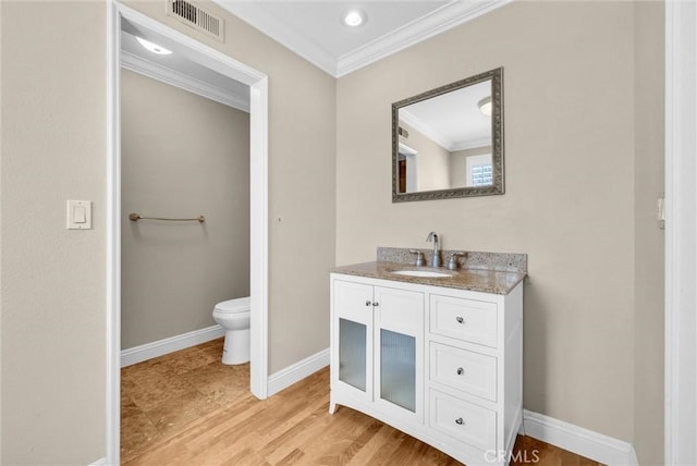 22517 Lazy Meadow Dr, Diamond Bar, CA 91765 - bathroom with ornamental molding, baseboards, vanity, toilet, and wood finished floors