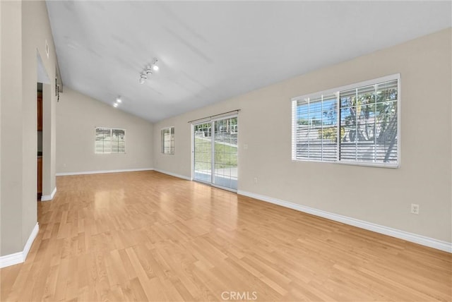 22517 Lazy Meadow Dr, Diamond Bar, CA 91765 - unfurnished room with light wood-style flooring, vaulted ceiling, and baseboards