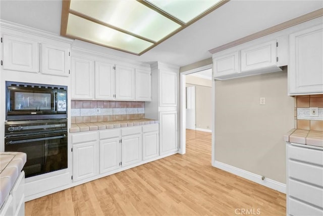 22517 Lazy Meadow Dr, Diamond Bar, CA 91765 - kitchen featuring black appliances, tile countertops, backsplash, and white cabinetry