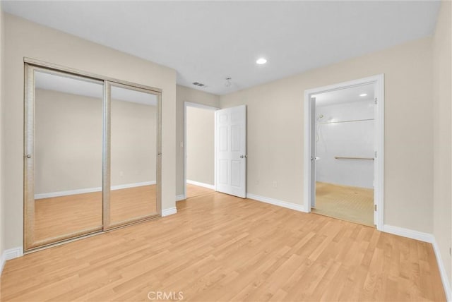 22517 Lazy Meadow Dr, Diamond Bar, CA 91765 - unfurnished bedroom with light wood-type flooring, baseboards, recessed lighting, ensuite bathroom, and a closet