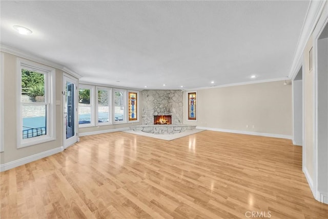 22517 Lazy Meadow Dr, Diamond Bar, CA 91765 - unfurnished living room featuring baseboards, light wood-type flooring, crown molding, a stone fireplace, and recessed lighting