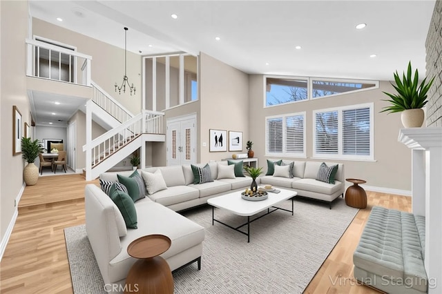 22517 Lazy Meadow Dr, Diamond Bar, CA 91765 - living area with high vaulted ceiling, wood finished floors, stairway, recessed lighting, and baseboards