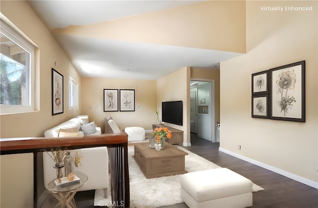 living room featuring dark wood finished floors and baseboards