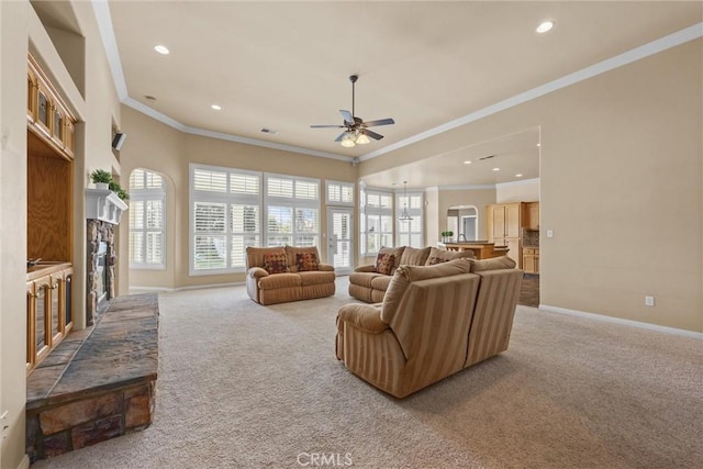 living room with carpet floors, ceiling fan, a fireplace, and baseboards