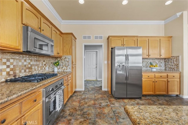 kitchen featuring visible vents, stainless steel appliances, and ornamental molding