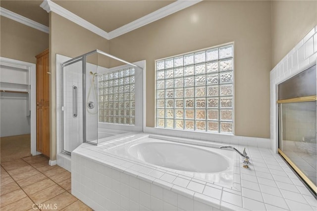 full bath featuring ornamental molding, a garden tub, and a shower stall