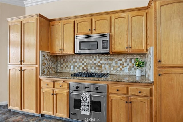 kitchen featuring stone counters, appliances with stainless steel finishes, backsplash, and crown molding