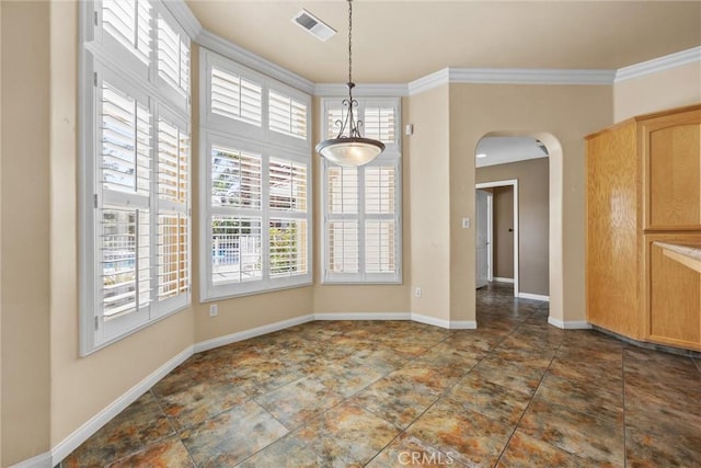 unfurnished dining area with ornamental molding, arched walkways, visible vents, and baseboards