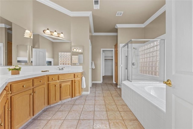 bathroom with a garden tub, ornamental molding, a stall shower, vanity, and tile patterned floors