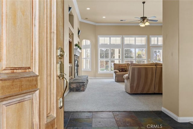 unfurnished room featuring recessed lighting, stone tile flooring, ornamental molding, a ceiling fan, and baseboards