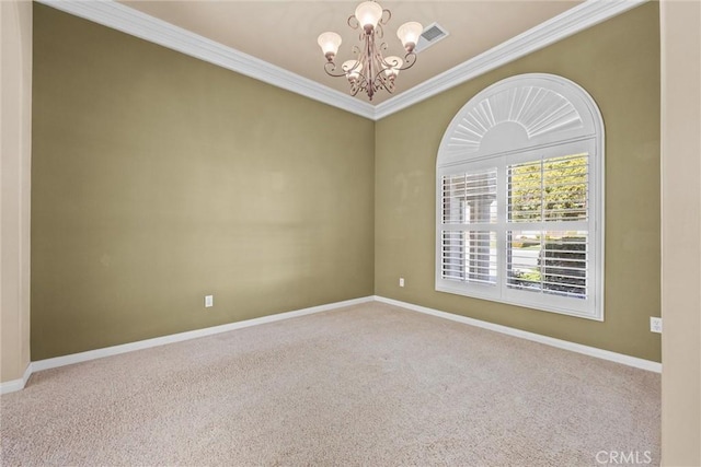 carpeted empty room with a chandelier, visible vents, ornamental molding, and baseboards