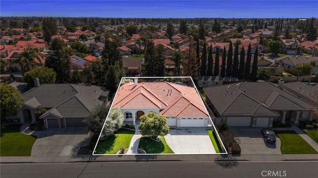 birds eye view of property with a residential view