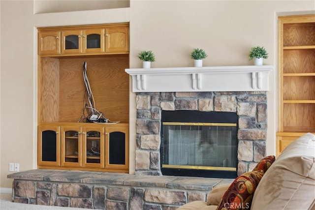 interior details with a fireplace and baseboards