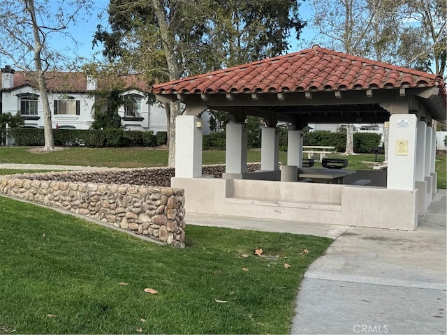 view of community featuring a lawn and a gazebo