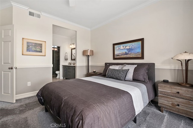 bedroom with ensuite bathroom, visible vents, baseboards, carpet, and crown molding