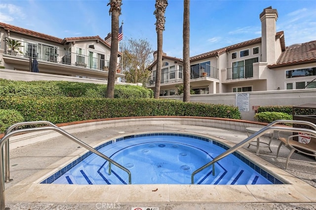 view of pool featuring a hot tub