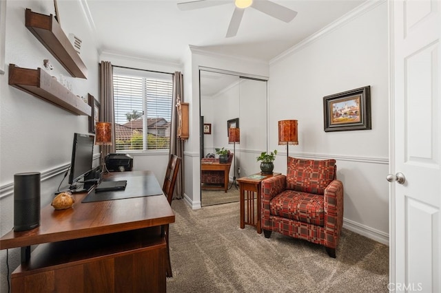 carpeted home office with ceiling fan, ornamental molding, and baseboards