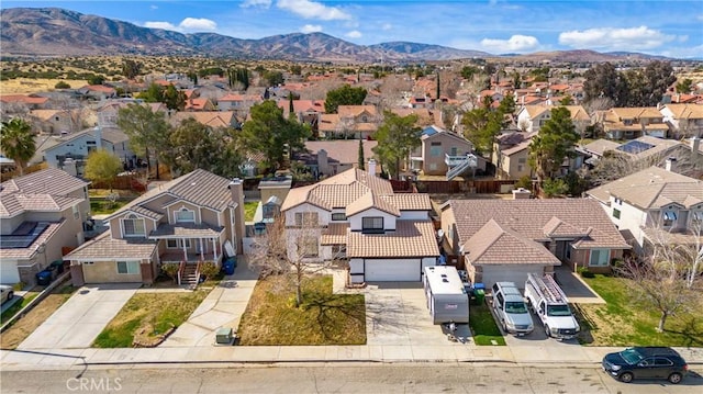 bird's eye view featuring a residential view and a mountain view