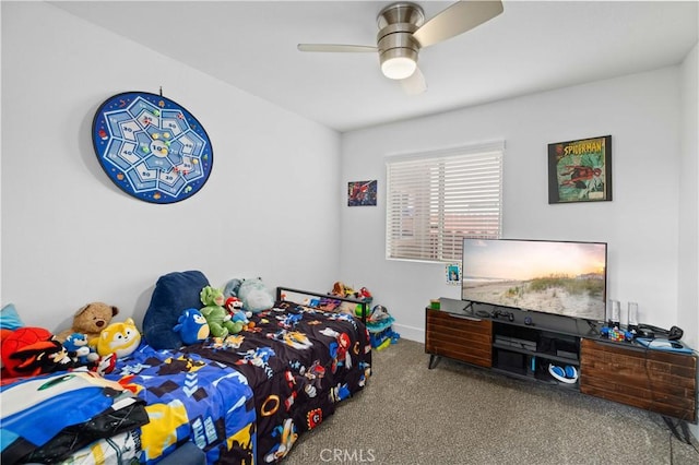 bedroom with ceiling fan, carpet, and baseboards