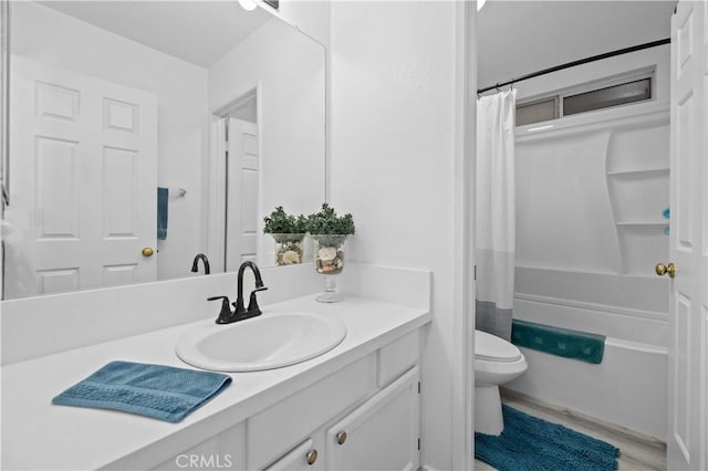 bathroom with wood finished floors, shower / bath combo, vanity, and toilet