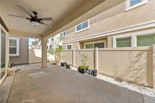 view of patio with ceiling fan and a fenced backyard