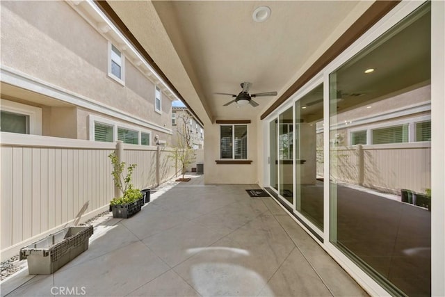 view of patio featuring ceiling fan and a fenced backyard