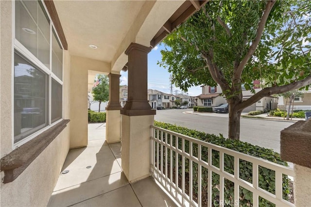 balcony featuring a porch and a residential view